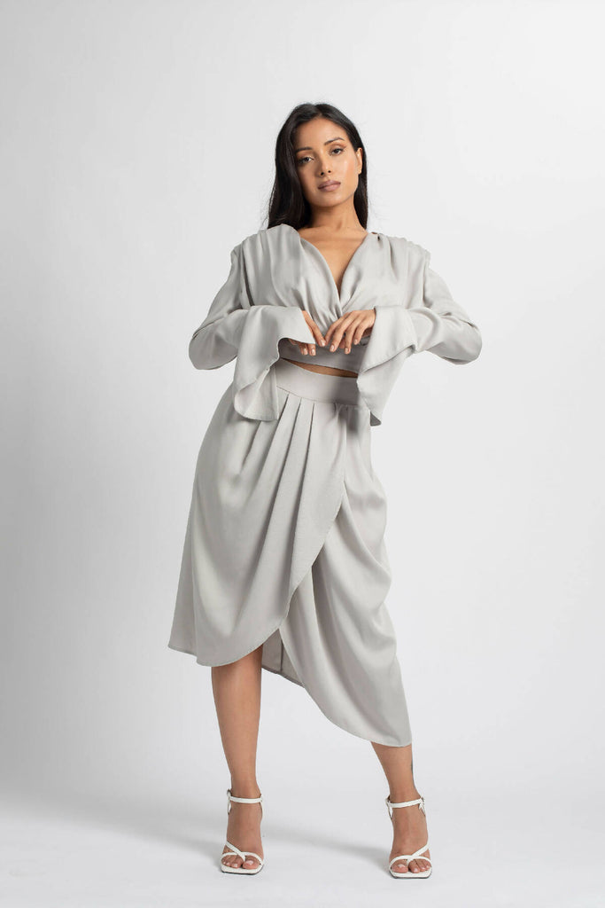 PLEATED SKIRT WITH ASYMMETRICAL OVERLAPPING