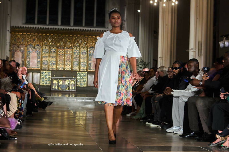 A-line dress with cut shoulders and removable skirt.