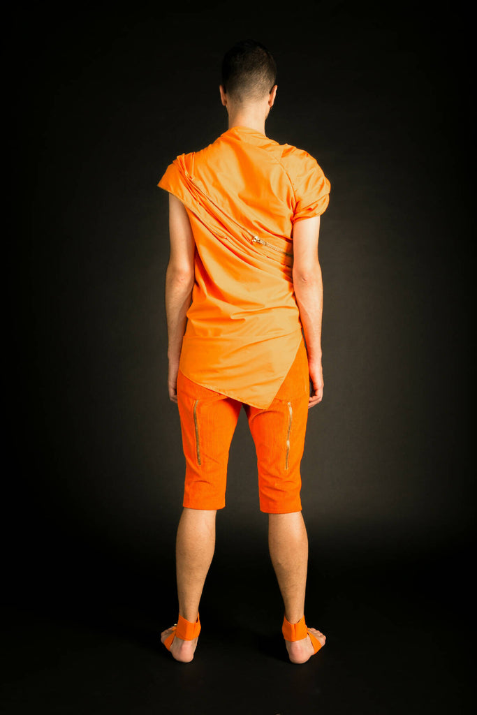 A draped sleeveless shirt.