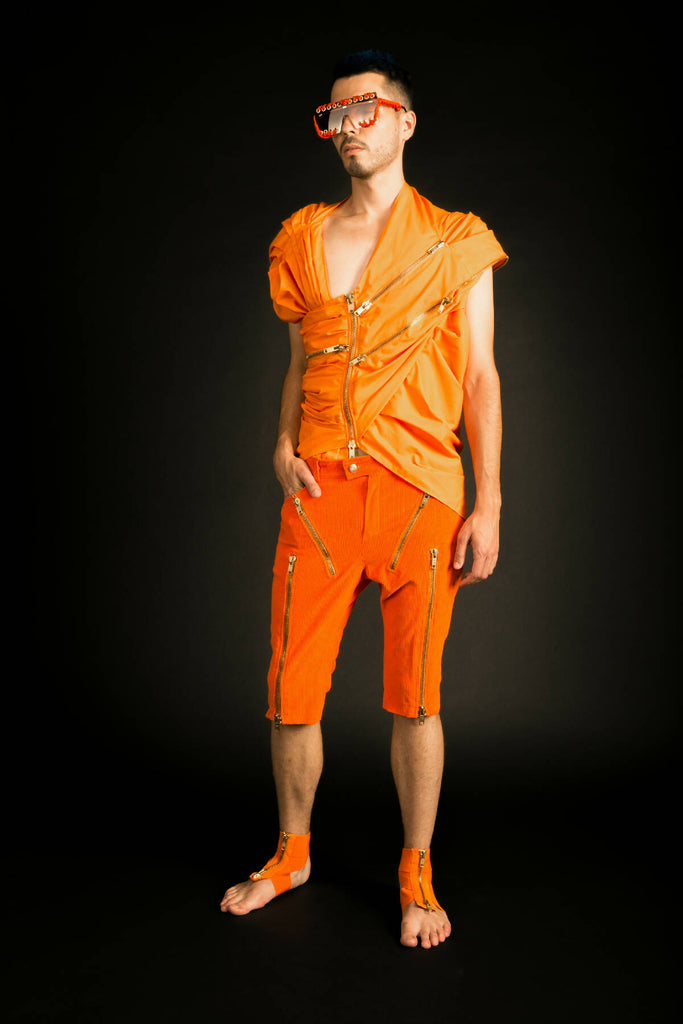 A draped sleeveless shirt.