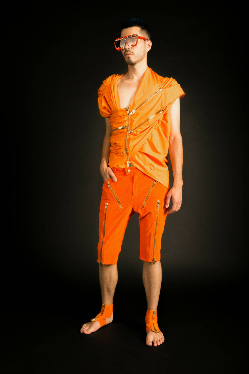 A draped sleeveless shirt.