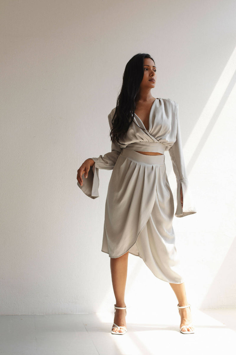 PLEATED SKIRT WITH ASYMMETRICAL OVERLAPPING